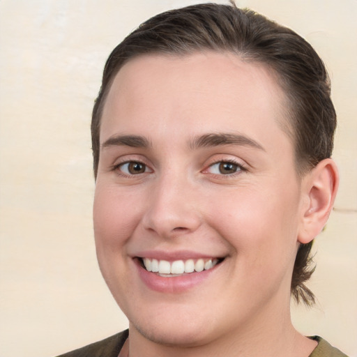 Joyful white young-adult female with medium  brown hair and brown eyes