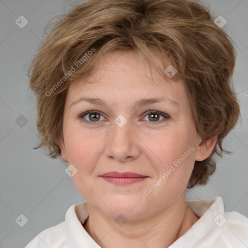 Joyful white adult female with medium  brown hair and blue eyes