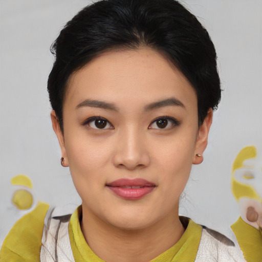 Joyful asian young-adult female with medium  black hair and brown eyes