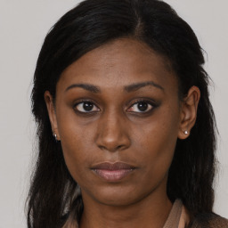 Neutral black young-adult female with long  brown hair and brown eyes