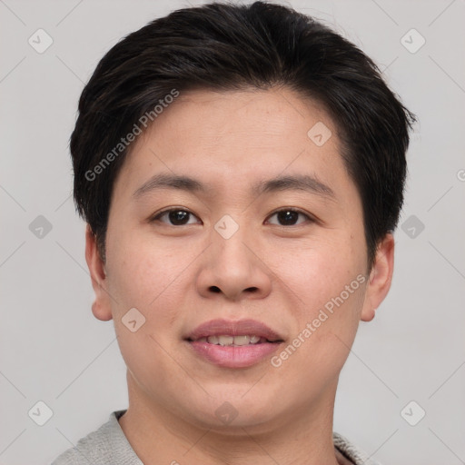 Joyful asian young-adult male with short  brown hair and brown eyes