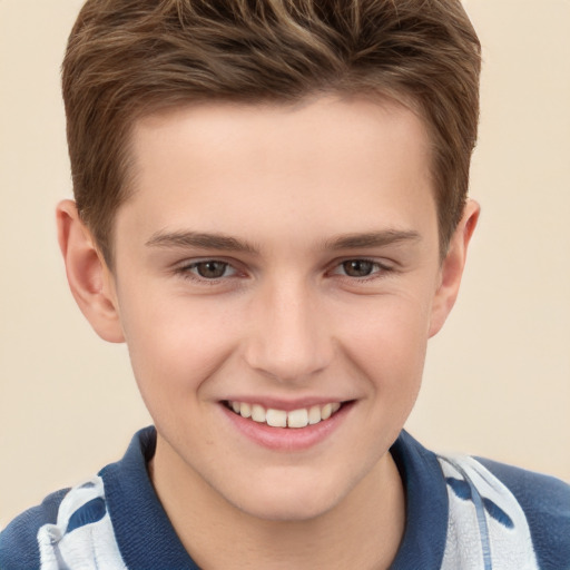 Joyful white child male with short  brown hair and brown eyes