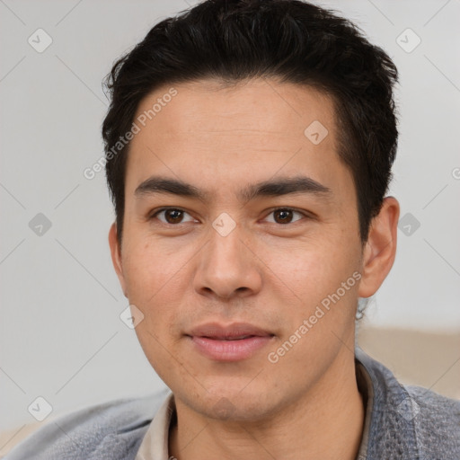 Joyful asian young-adult male with short  black hair and brown eyes