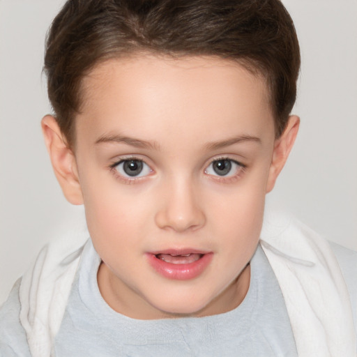 Joyful white child female with short  brown hair and brown eyes