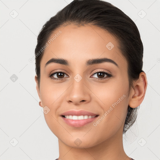 Joyful white young-adult female with long  brown hair and brown eyes