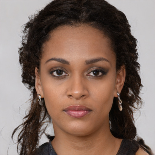 Neutral black young-adult female with long  brown hair and brown eyes