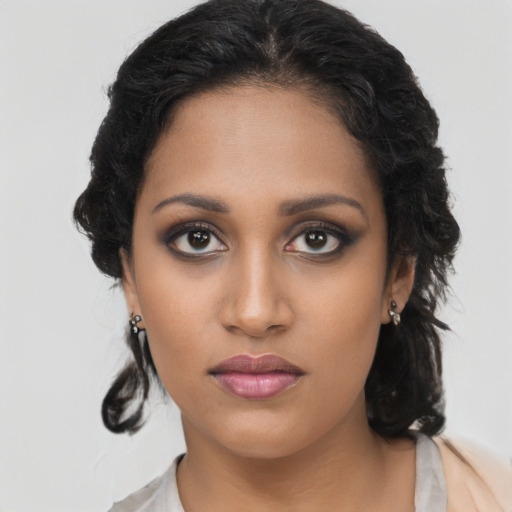 Neutral black young-adult female with long  brown hair and brown eyes
