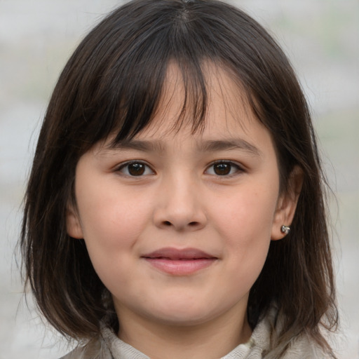 Joyful white child female with medium  brown hair and brown eyes