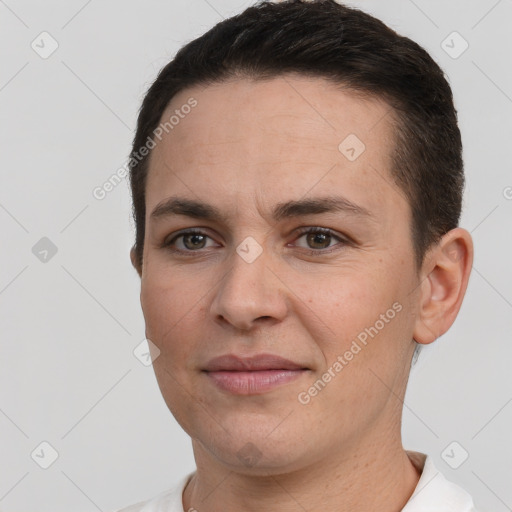 Joyful white young-adult female with short  brown hair and brown eyes