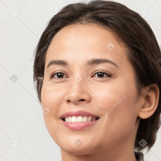 Joyful white young-adult female with medium  brown hair and brown eyes