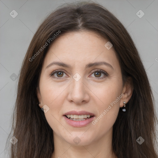 Joyful white adult female with long  brown hair and brown eyes