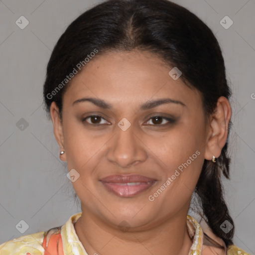 Joyful latino adult female with medium  brown hair and brown eyes