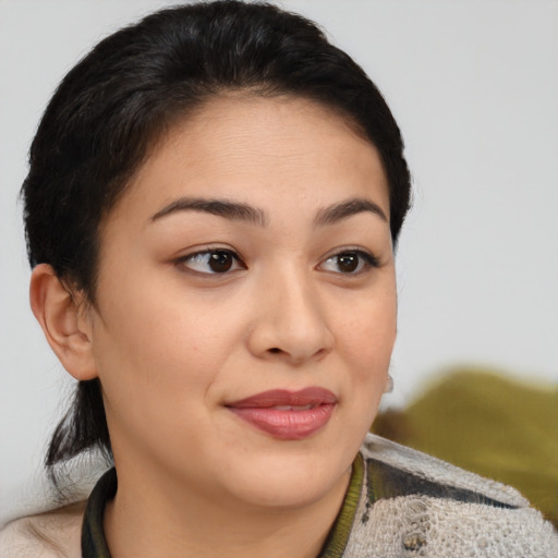 Joyful asian young-adult female with medium  brown hair and brown eyes