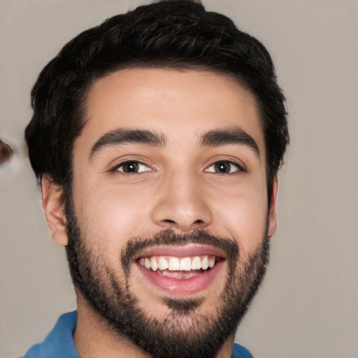 Joyful white young-adult male with short  black hair and brown eyes