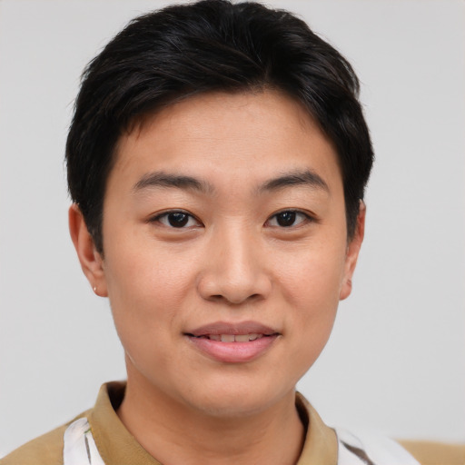 Joyful asian young-adult female with short  brown hair and brown eyes