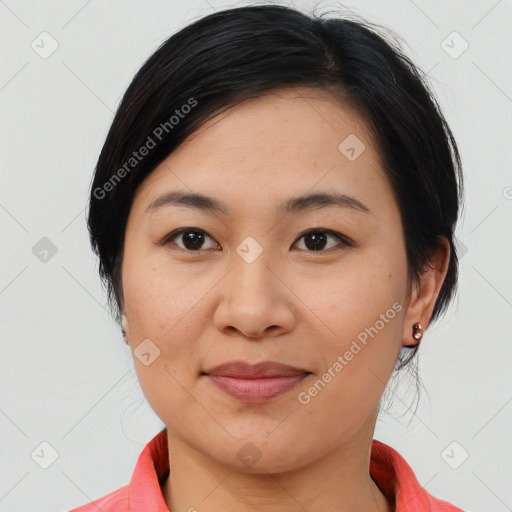 Joyful latino young-adult female with medium  brown hair and brown eyes