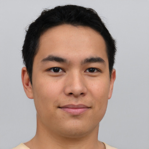 Joyful asian young-adult male with short  brown hair and brown eyes
