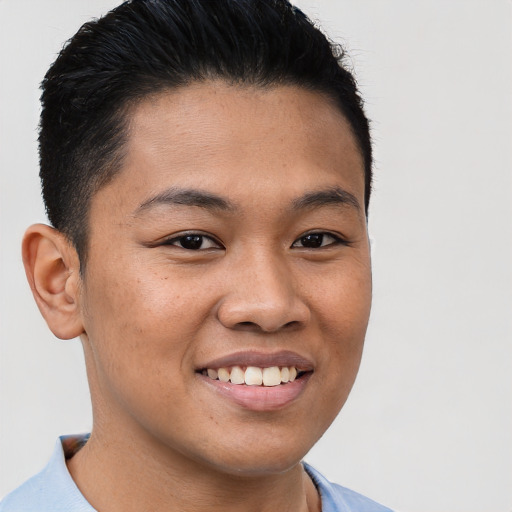 Joyful asian young-adult male with short  brown hair and brown eyes