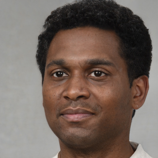 Neutral black young-adult male with short  black hair and brown eyes