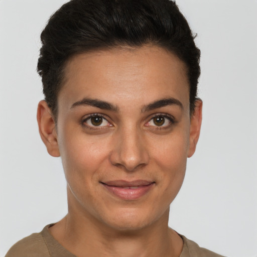 Joyful white young-adult female with short  brown hair and brown eyes