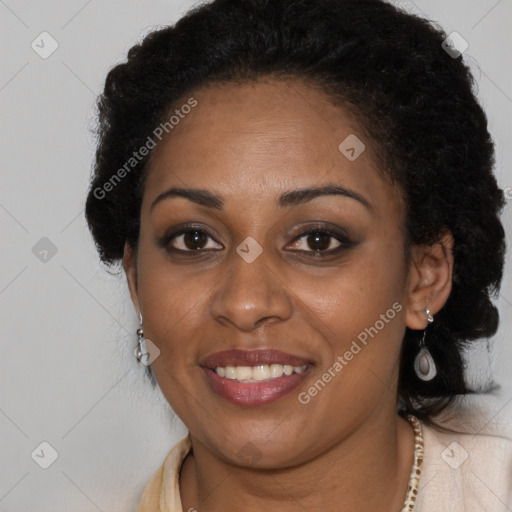 Joyful black young-adult female with long  brown hair and brown eyes