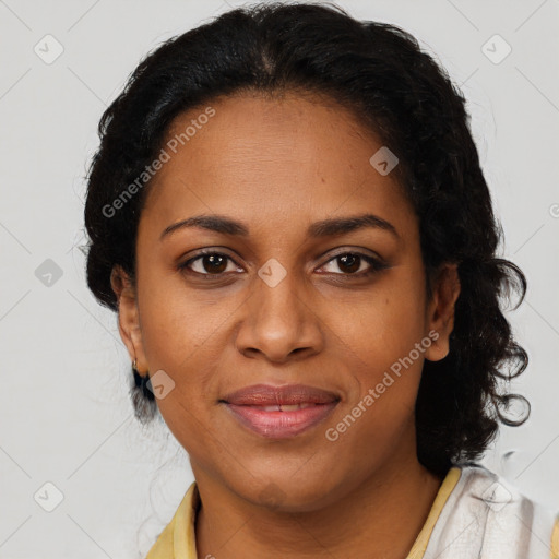 Joyful black adult female with short  brown hair and brown eyes