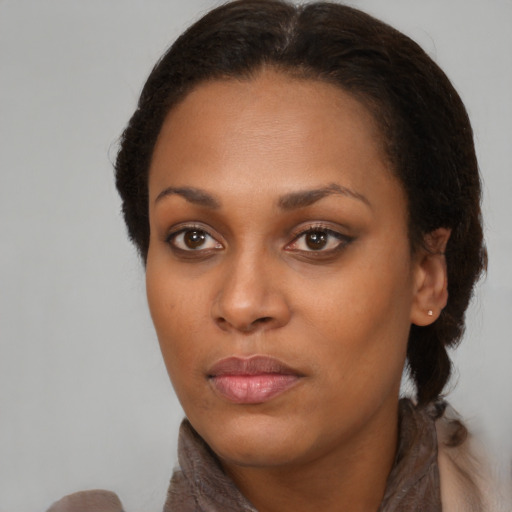 Neutral black young-adult female with medium  brown hair and brown eyes