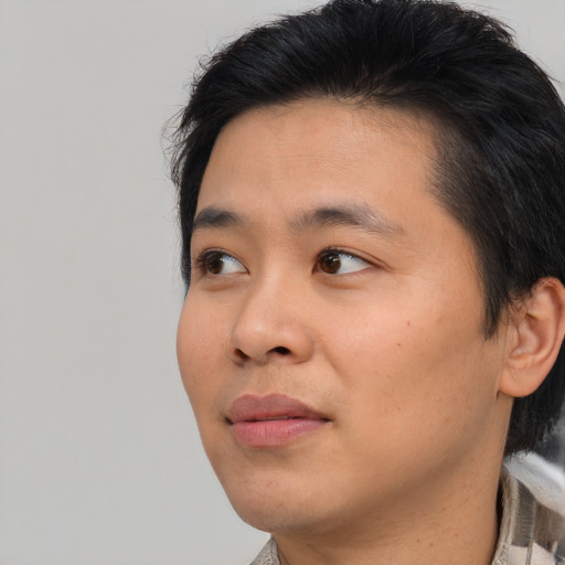 Neutral asian young-adult male with short  brown hair and brown eyes