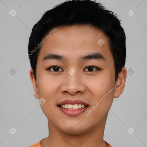 Joyful asian young-adult male with short  black hair and brown eyes