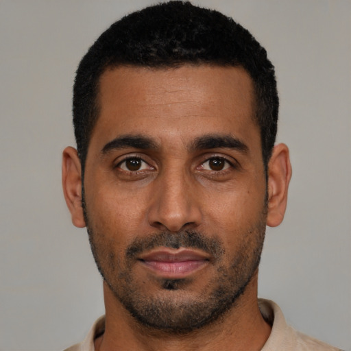 Neutral black young-adult male with short  black hair and brown eyes