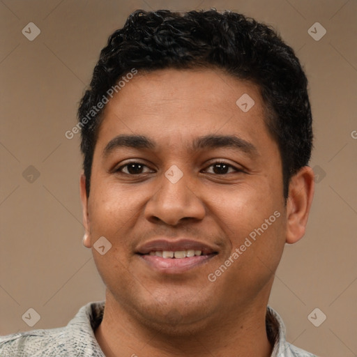 Joyful latino young-adult male with short  black hair and brown eyes