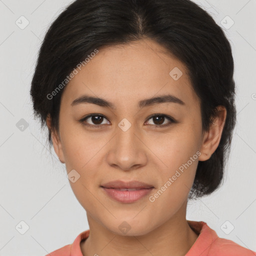 Joyful latino young-adult female with medium  brown hair and brown eyes