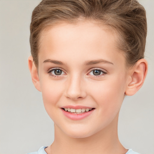 Joyful white child female with short  brown hair and brown eyes