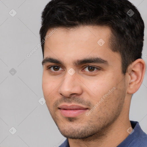 Joyful white young-adult male with short  black hair and brown eyes