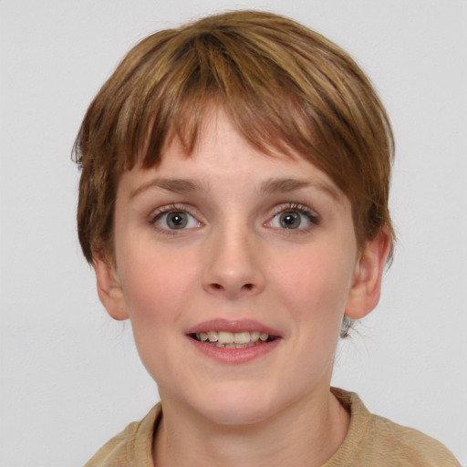 Joyful white young-adult female with medium  brown hair and grey eyes