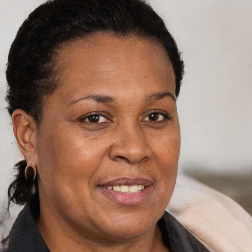 Joyful white adult female with short  brown hair and brown eyes