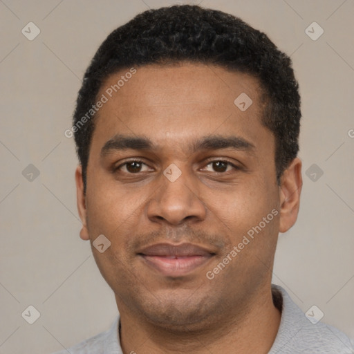 Joyful black young-adult male with short  black hair and brown eyes