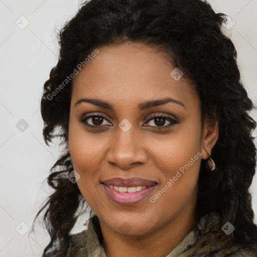 Joyful black young-adult female with long  brown hair and brown eyes