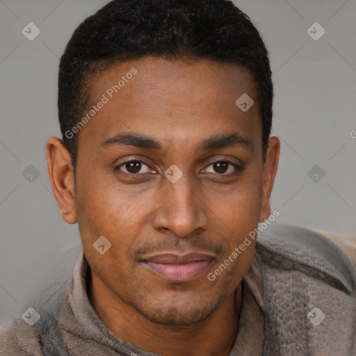 Joyful black young-adult male with short  brown hair and brown eyes