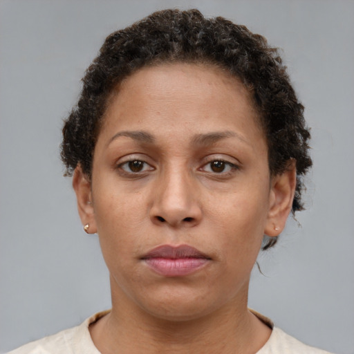 Neutral black adult female with short  brown hair and brown eyes