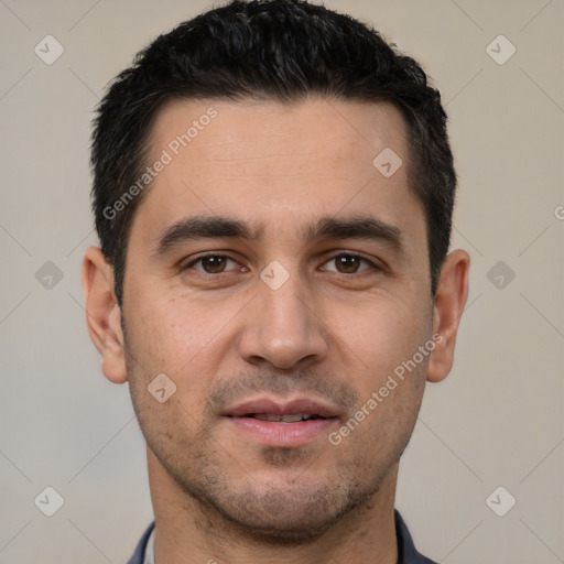 Joyful white young-adult male with short  black hair and brown eyes