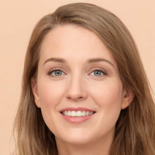 Joyful white young-adult female with long  brown hair and grey eyes