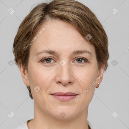 Joyful white adult female with short  brown hair and grey eyes