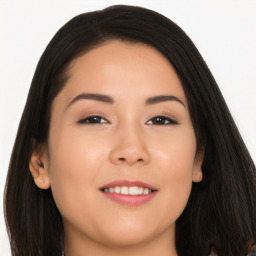 Joyful asian young-adult female with long  brown hair and brown eyes