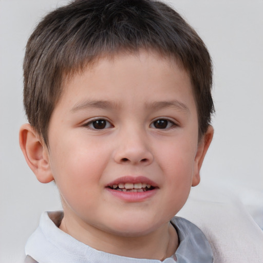 Joyful white child male with short  brown hair and brown eyes