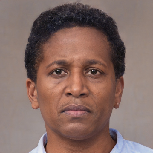 Neutral latino adult male with short  brown hair and brown eyes