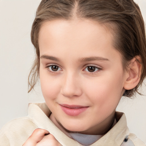 Joyful white child female with medium  brown hair and brown eyes