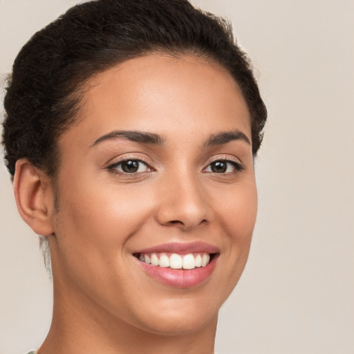 Joyful white young-adult female with short  brown hair and brown eyes