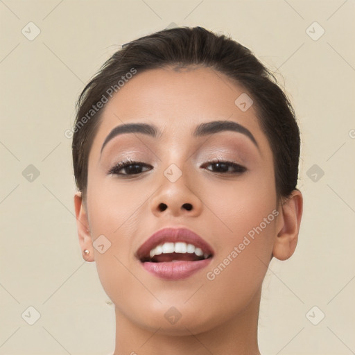 Joyful asian young-adult female with long  brown hair and brown eyes