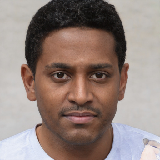 Neutral black young-adult male with short  brown hair and brown eyes